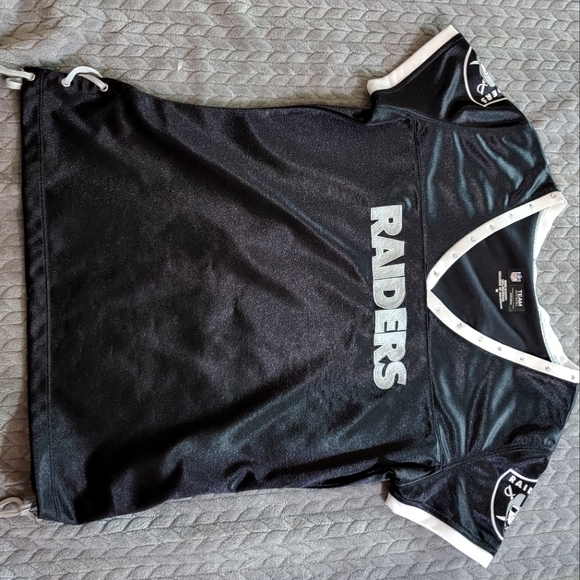 Draft Me Raider's top with ties and grommets on the side and rhinestones. - Picture 1 of 3